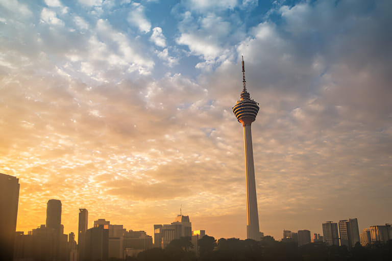 misty-sunrise-over-city-skyline-with-kuala-lumpur-tower