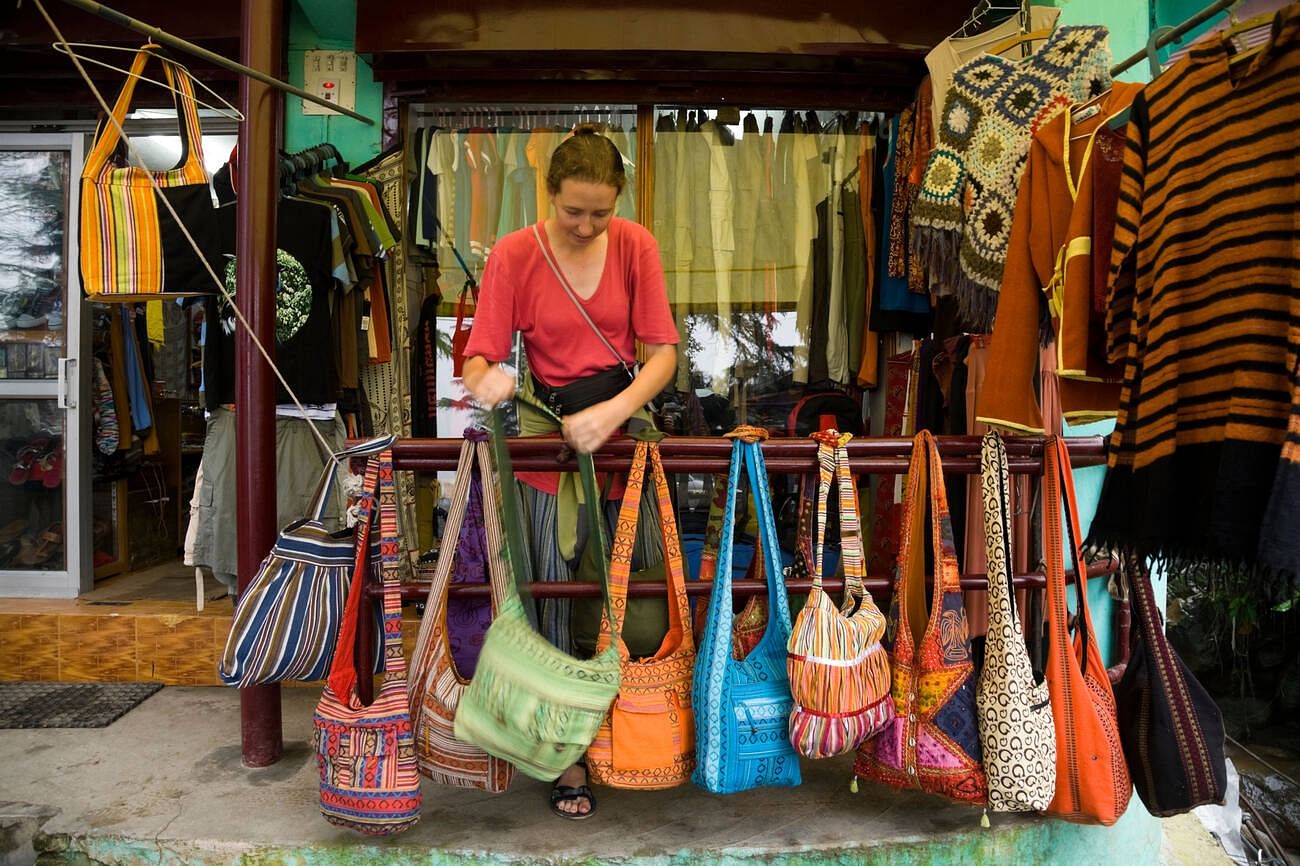 western-woman-tourist-choosing-a-bag-at-kangra
